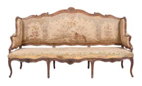 A LOUIS XV CARVED BEECH SETTEE