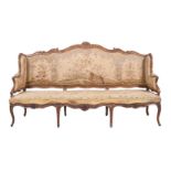 A LOUIS XV CARVED BEECH SETTEE