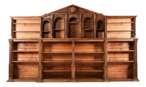 A VICTORIAN CARVED OAK LIBRARY BOOKCASE