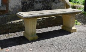 A CARVED STONE BENCH