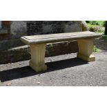 A CARVED STONE BENCH