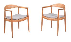 A PAIR OF OAK AND CANEWORK CHAIRS AFTER HANS WEGNER