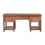 A LATE VICTORIAN ARTS & CRAFTS OAK SIDEBOARD