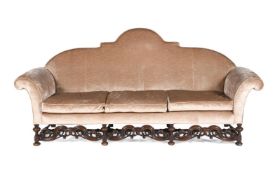 A LARGE WALNUT AND UPHOLSTERED SOFA, IN WILLIAM & MARY STYLE