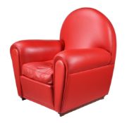 A RED LEATHER UPHOLSTERED ARMCHAIR