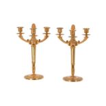 A PAIR OF MODERN GILT METAL THREE ARM CANDELABRA IN EMPIRE STYLE