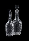 A CUT-GLASS DECANTER AND STOPPER