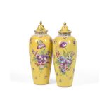 A PAIR OF DRESDEN YELLOW GROUND SLENDER OVOID VASES AND COVERS