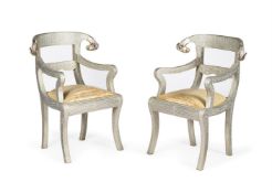 A PAIR OF INDIAN SILVERED METAL ARMCHAIRS