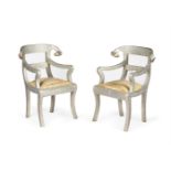 A PAIR OF INDIAN SILVERED METAL ARMCHAIRS