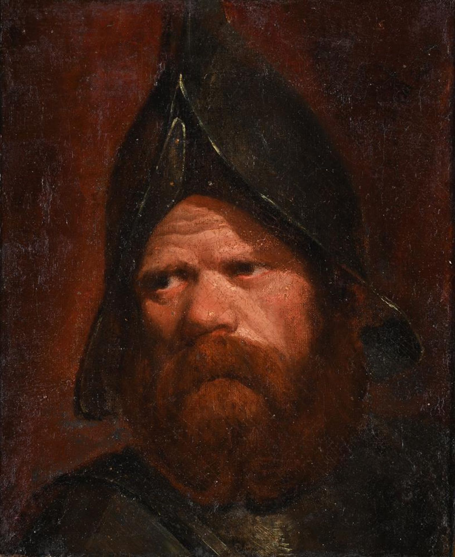FOLLOWER OF REMBRANDT, PORTRAIT OF A SOLDIER WEARING A HELMET