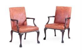 A PAIR OF CARVED MAHOGANY AND LEATHER UPHOLSTERED ARMCHAIRS, IN GEORGE II STYLE, 20TH CENTURY