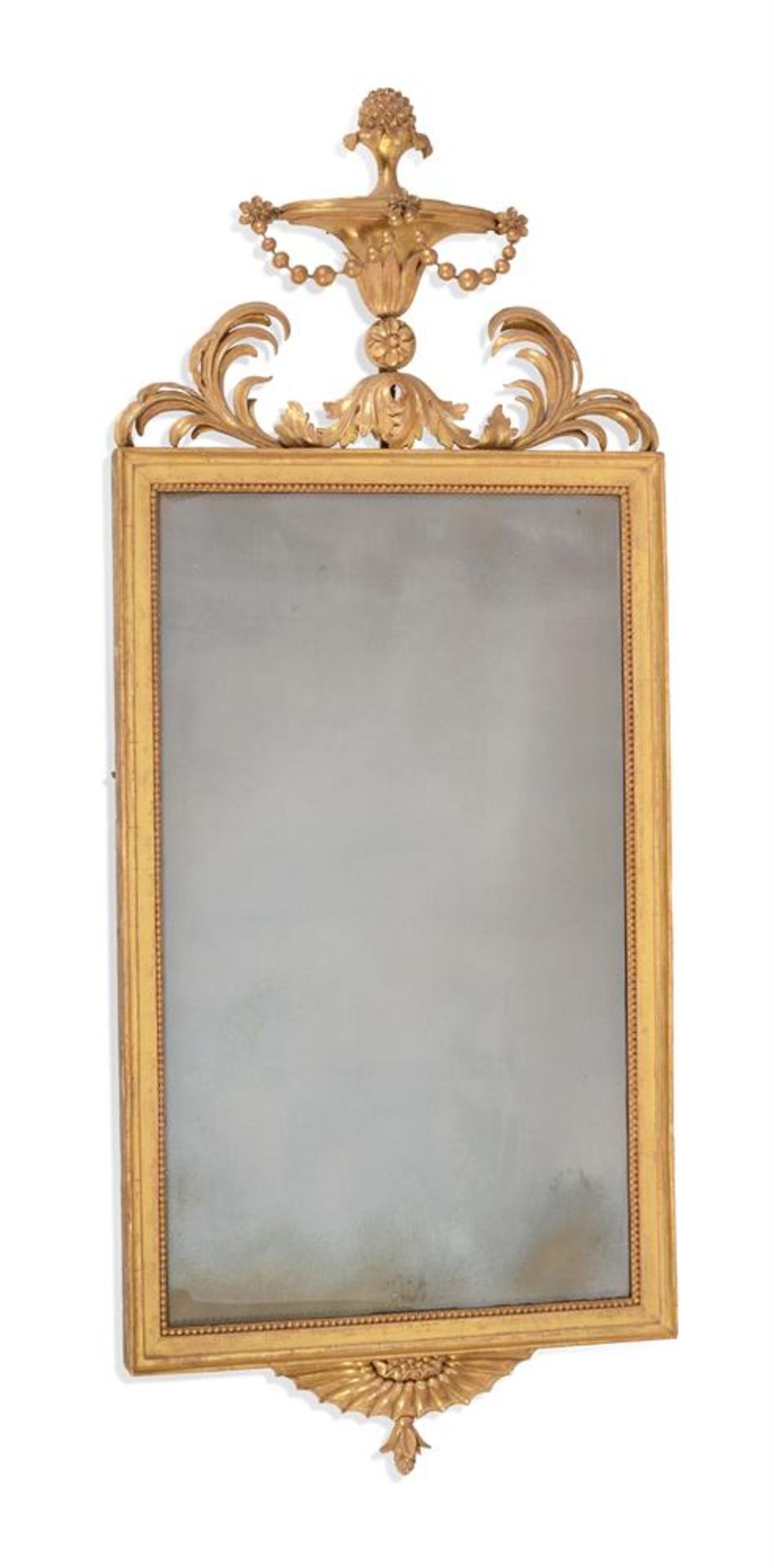 A GEORGE III CARVED GILTWOOD WALL MIRROR, IN THE MANNER OF ROBERT ADAM, CIRCA 1790