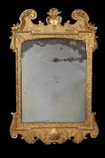 A GEORGE II CARVED GILTWOOD WALL MIRROR, MID 18TH CENTURY
