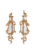 A PAIR OF CARVED GILTWOOD MIRRORS, IN GEORGE III STYLE, 19TH CENTURY
