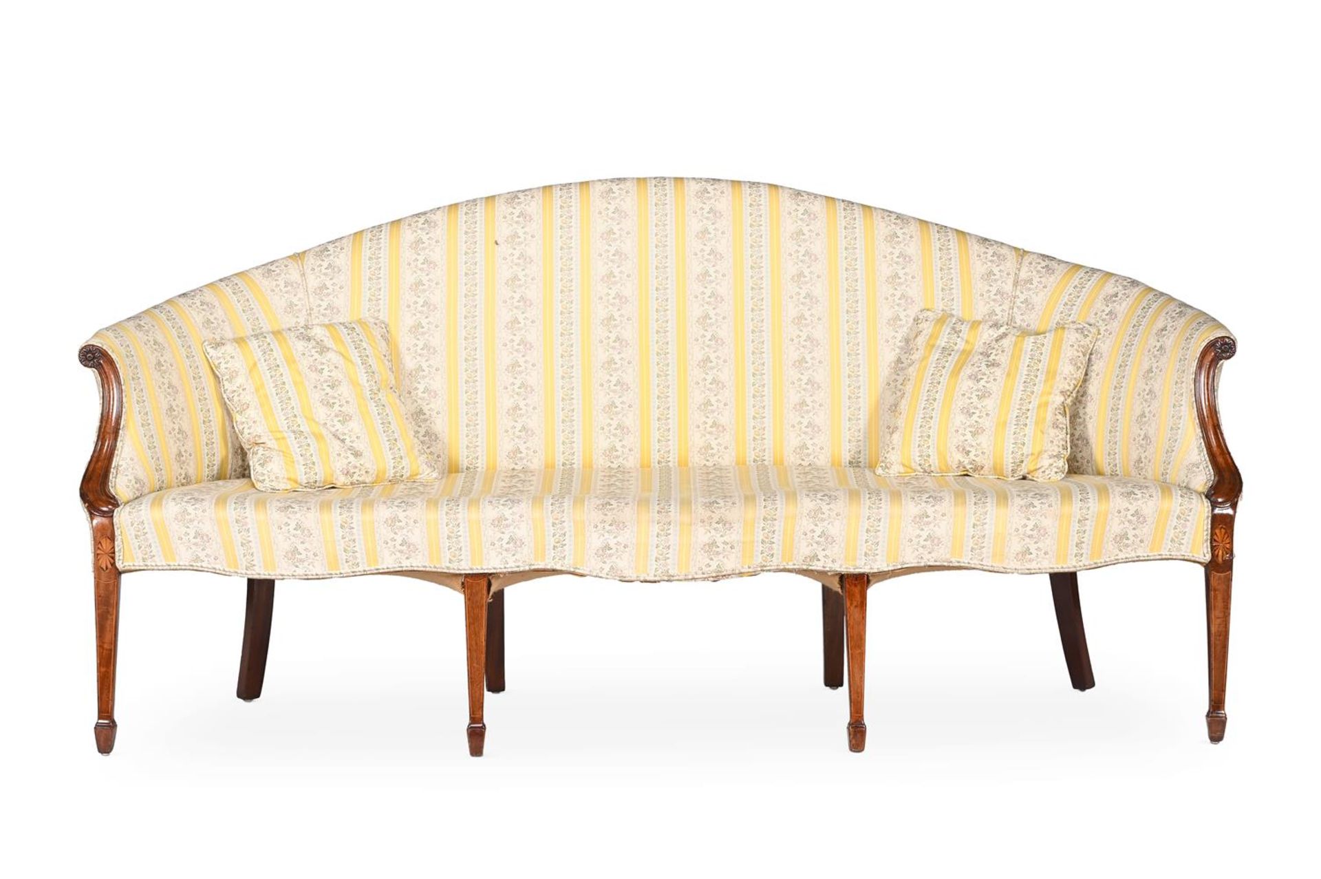 A GEORGE III MAHOGANY AND UPHOLSTERED SERPENTINE SHAPED SOFAIN THE MANNER OF GEORGE HEPPLEWHITE