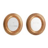 A PAIR OF GILTWOOD AND COMPOSITION OVAL MIRRORS, 19TH CENTURY