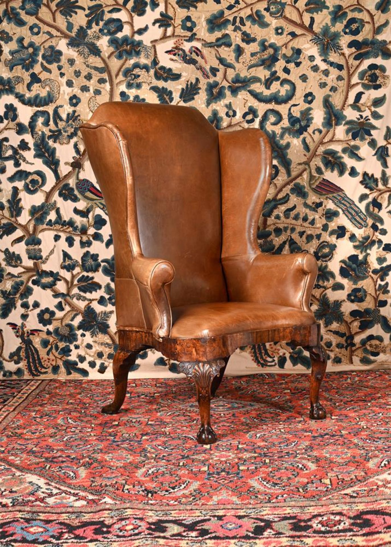 A GEORGE I WALNUT WING ARMCHAIR, CIRCA 1725