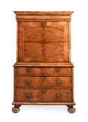 A QUEEN ANNE WALNUT AND FEATHER-BANDED ESCRITOIRE, CIRCA 1710