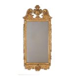 A GEORGE II CARVED GILTWOOD AND GESSO MIRROR, CIRCA 1740