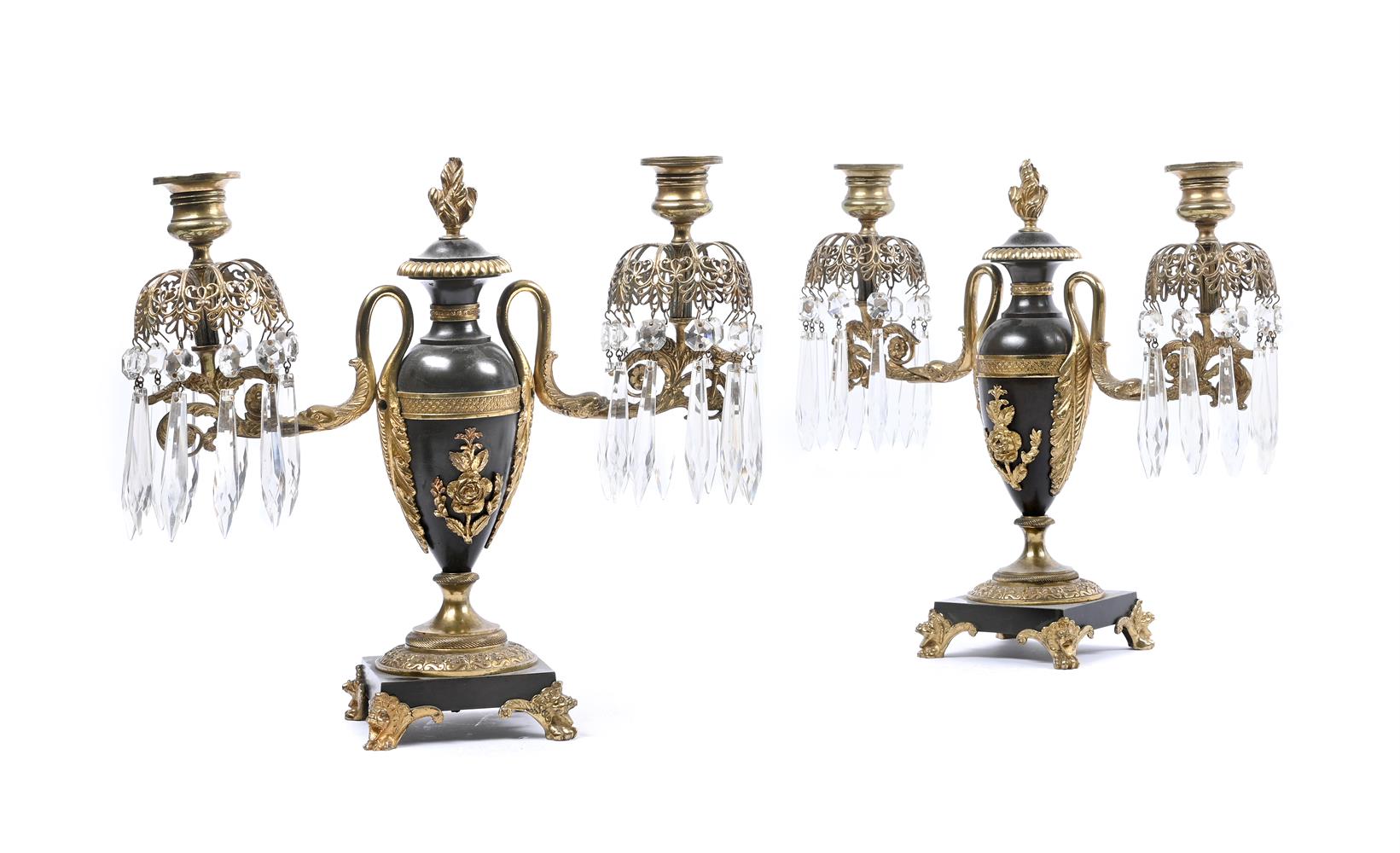 A PAIR OF REGENCY PATINATED AND GILT BRONZE TWIN LIGHT CANDELABRA, EARLY 19TH CENTURY