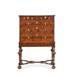 A WILLIAM & MARY OLIVEWOOD OYSTER VENEERED AND YEW CHEST ON LATER STAND, THE CHEST CIRCA 1690