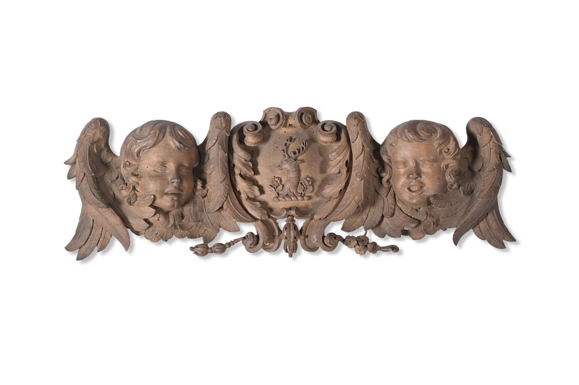 A CARVED LIMEWOOD ARMORIAL OVERDOOR OR PEDIMENT IN THE MANNER OF GRINLING GIBBONS, 19TH CENTURY