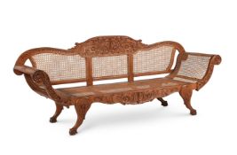 AN ANGLO-INDIAN SOLID PADOUK AND CANED SOFA, CEYLONESE, LATE 19TH CENTURY