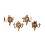 A SET OF FOUR FRENCH GILT BRONZE THREE LIGHT WALL LIGHTS, IN THE MANNER OF DASSON, CIRCA 1860