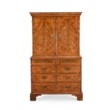 A GEORGE II FIGURED WALNUT CABINET ON CHEST, CIRCA 1720