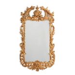 A GEORGE II CARVED GILTWOOD WALL MIRROR, CIRCA 1755-60