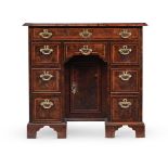 A GEORGE II BURR YEW AND LINE INLAID KNEEHOLE DESK, CIRCA 1740