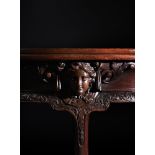 A GEORGE II CARVED MAHOGANY FOLDING TEA TABLE, CIRCA 1740-50