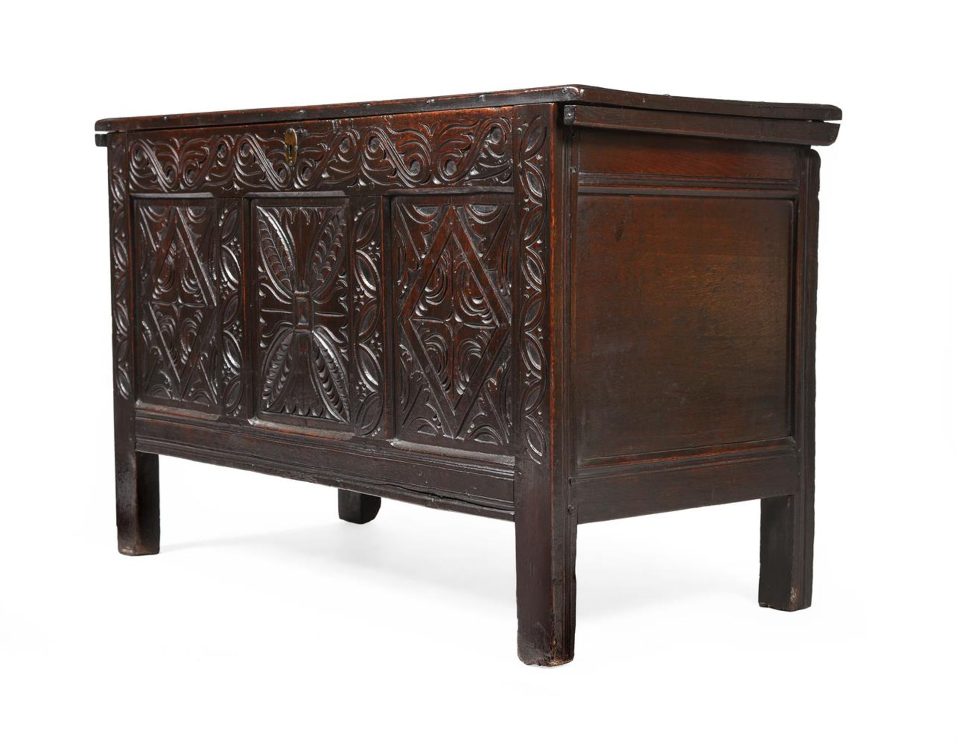 A CHARLES II CARVED OAK COFFER, CIRCA 1680