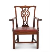 A GEORGE II MAHOGANY OPEN ARMCHAIR, IN THE MANNER OF THOMAS CHIPPENDALE, CIRCA 1765