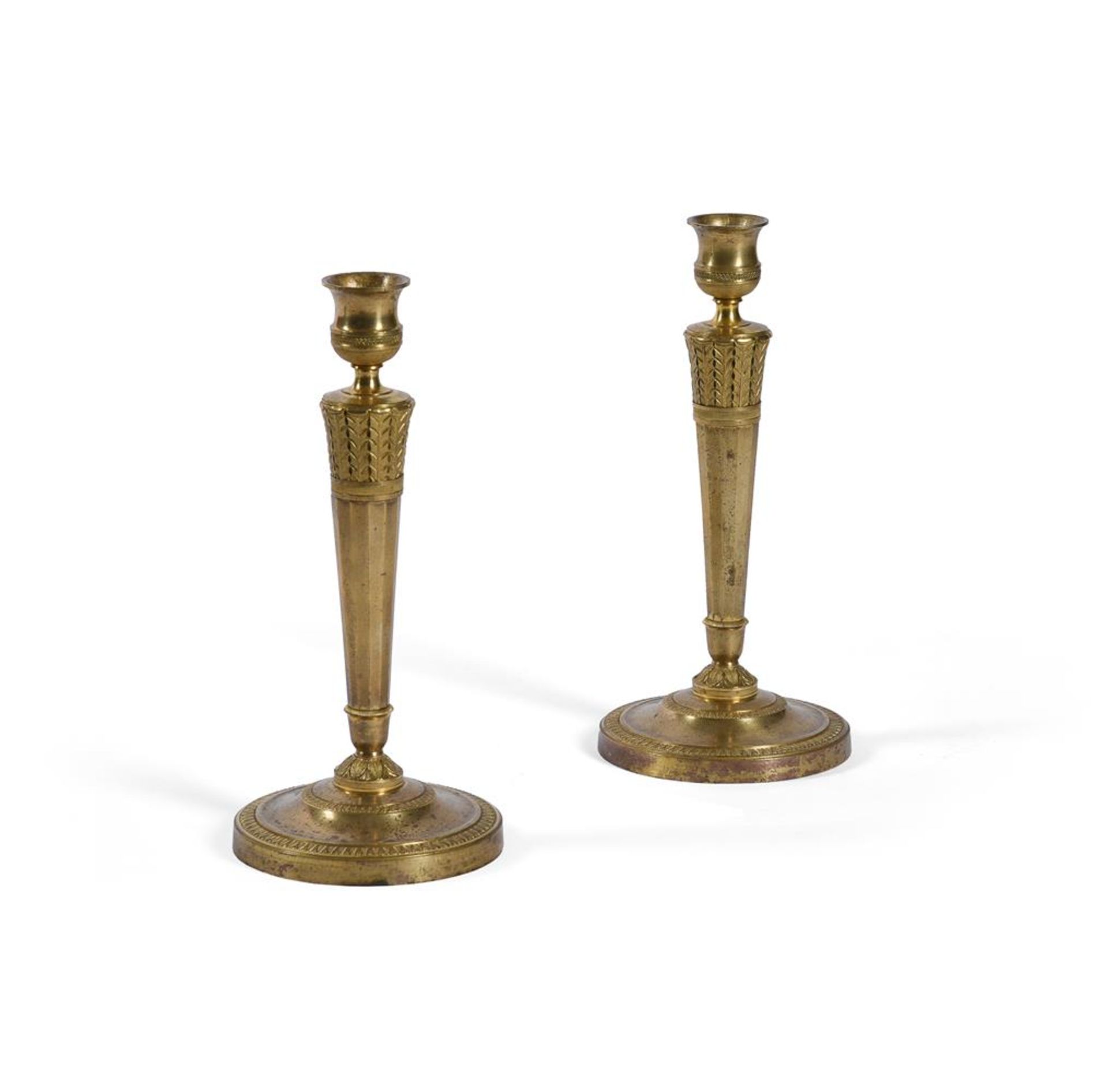 A PAIR OF EMPIRE ORMOLU CANDLESTICKS, FRENCH, EARLY 19TH CENTURY