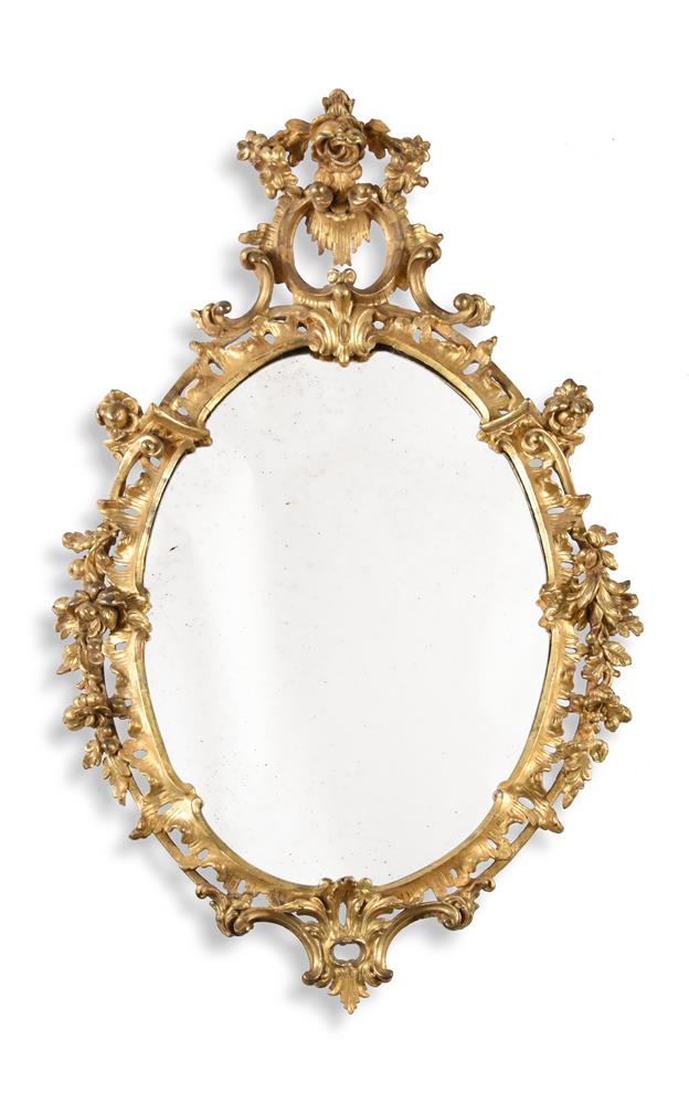 A GEORGE III CARVED GILTWOOD WALL MIRROR, CIRCA 1760