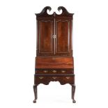 AN IRISH GEORGE II MAHOGANY BUREAU CABINET, CIRCA 1760