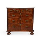 A QUEEN ANNE FIGURED WALNUT AND FEATHER-BANDED CHEST OF DRAWERS, CIRCA 1710