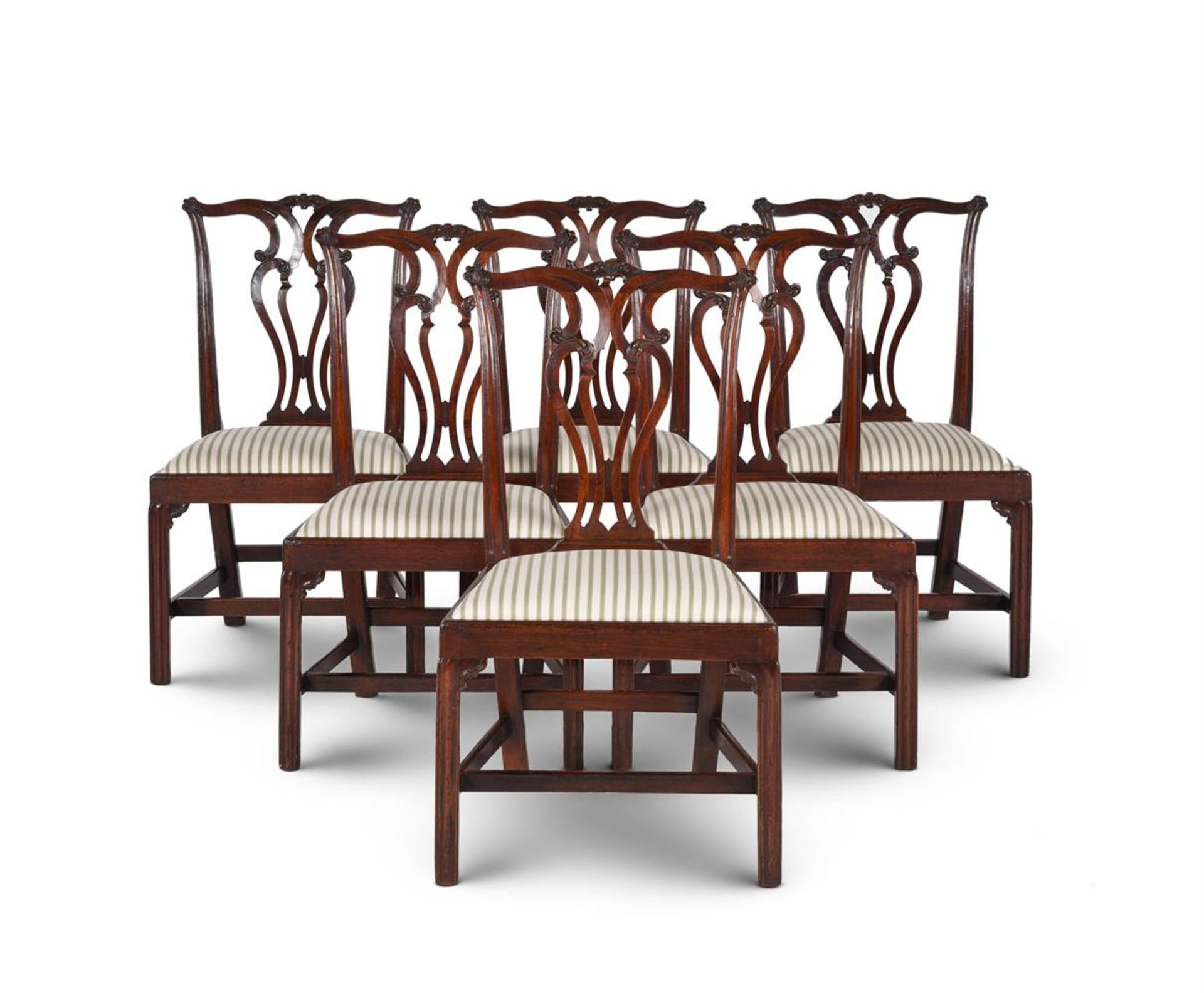 A SET OF SIX GEORGE III MAHOGANY DINING CHAIRS, IN THE MANNER OF THOMAS CHIPPENDALE, CIRCA 1770