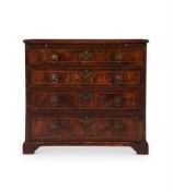 A GEORGE II FIGURED WALNUT AND FEATHER-BANDED CHEST OF DRAWERS, CIRCA 1730