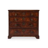 A GEORGE II FIGURED WALNUT AND FEATHER-BANDED CHEST OF DRAWERS, CIRCA 1730
