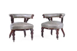 A PAIR OF VICTORIAN LEATHER UPHOLSTERED DESK ARMCHAIRS, CIRCA 1850