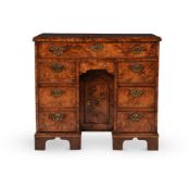 A GEORGE II BURR ASH KNEEHOLE DESK OR DRESSING TABLE. MID 18TH CENTURY