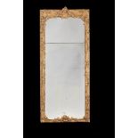 A LOUIS XV CARVED GILTWOOD MIRROR, CIRCA 1770