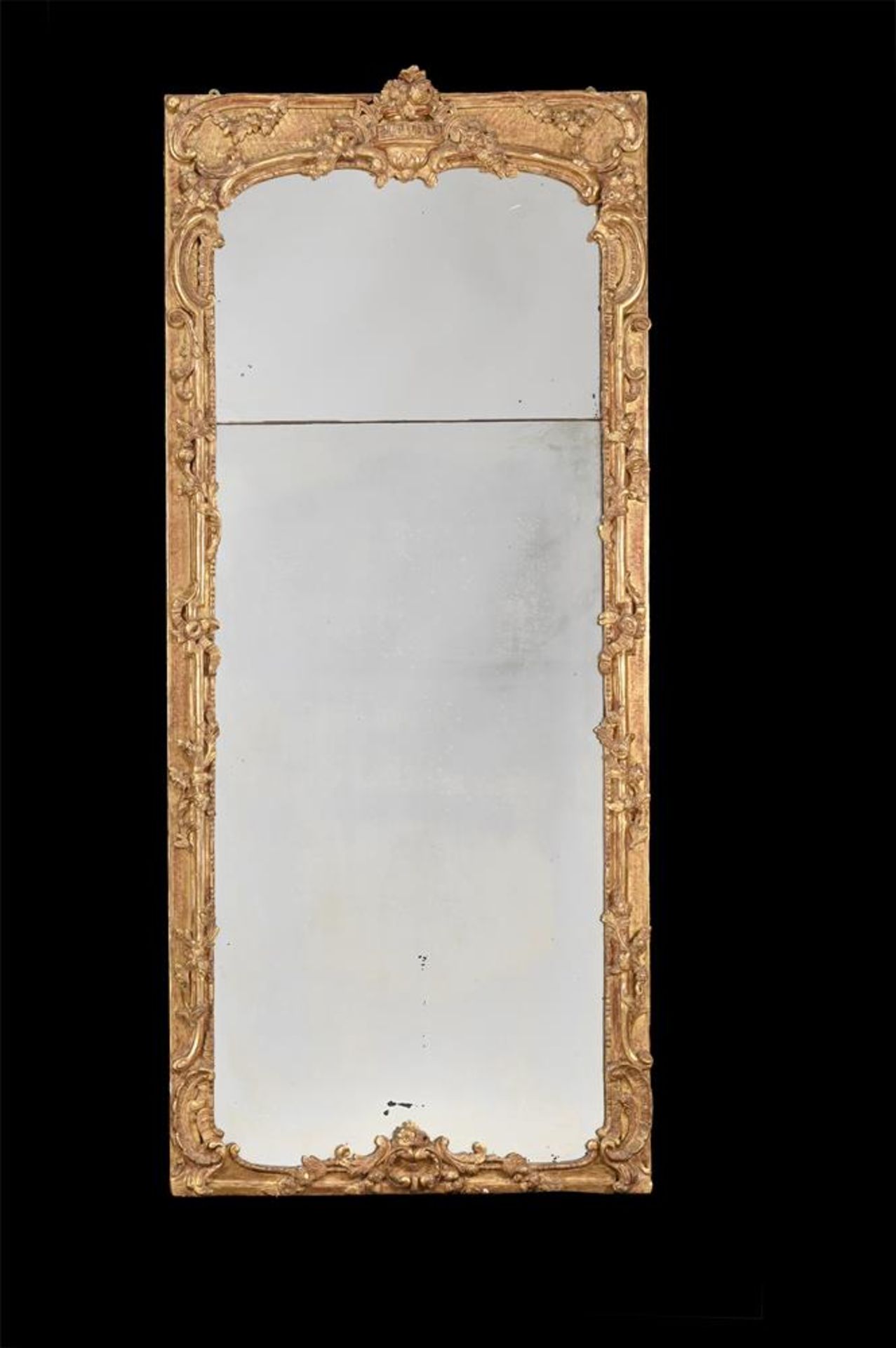 A LOUIS XV CARVED GILTWOOD MIRROR, CIRCA 1770