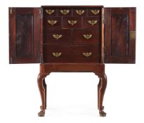 A GEORGE II MAHOGANY COLLECTORS CABINET ON STAND, CIRCA 1750