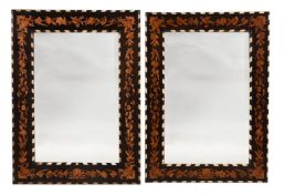 Y A NEAR PAIR OF ITALIAN EBONISED, MARQUETRY AND IVORY INLAID MIRRORS, SECOND HALF 19TH CENTURY