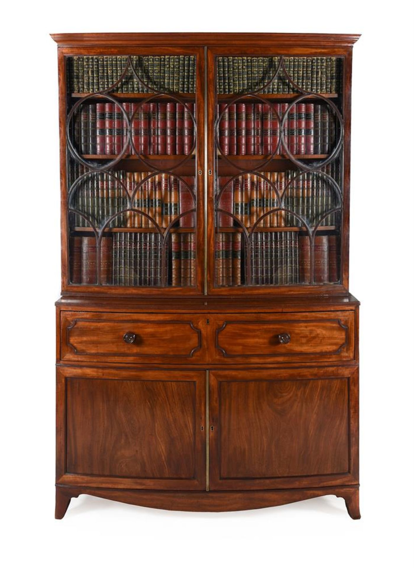 Y A REGENCY MAHOGANY BOWFRONT SECRETAIRE BOOKCASE, IN THE MANNER OF GILLOWS, CIRCA 1820