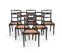 A SET OF TWELVE REGENCY EBONISED BEECH AND GILT METAL MOUNTED DINING CHAIRS, CIRCA 1810